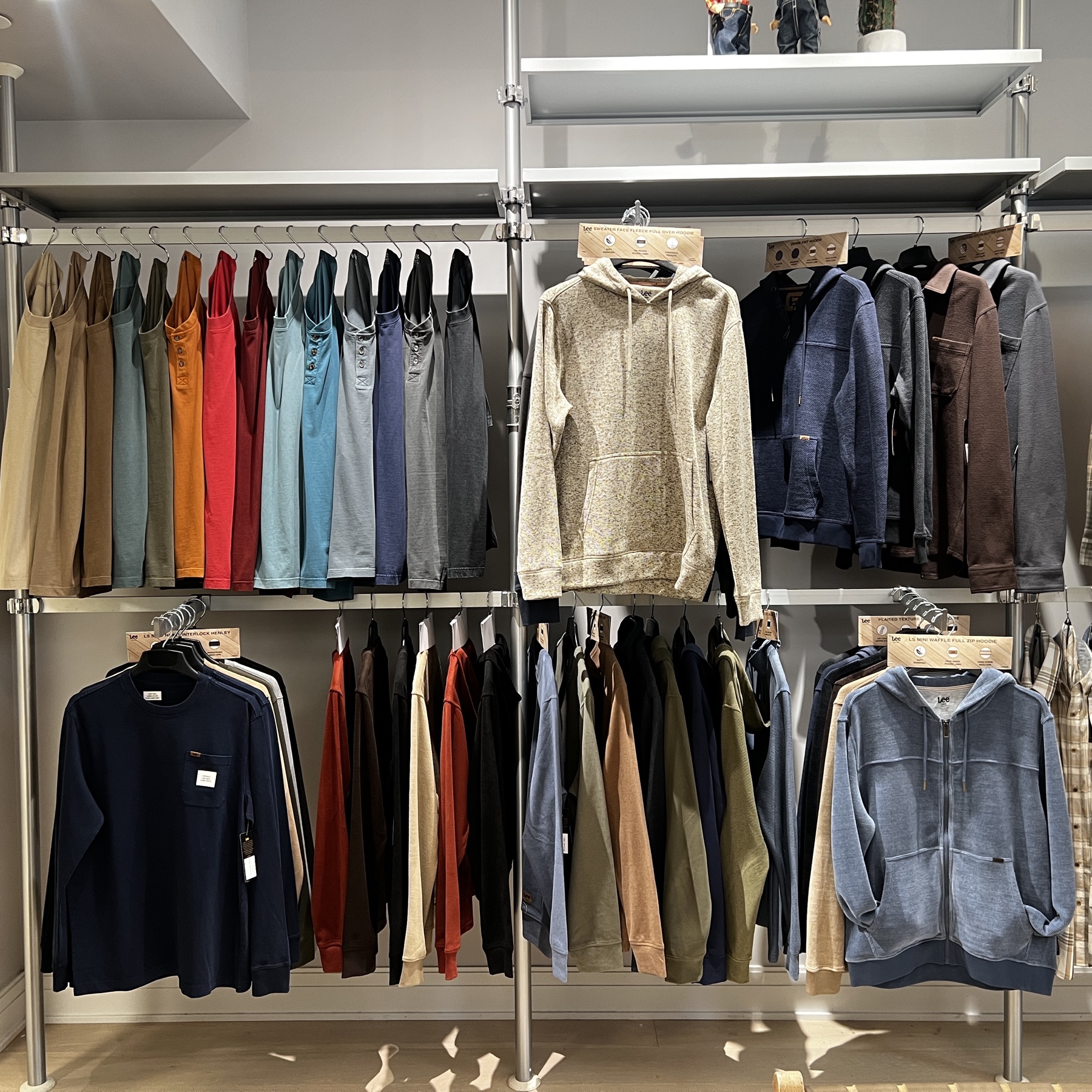 Lee men's showroom wall with knits and fleece